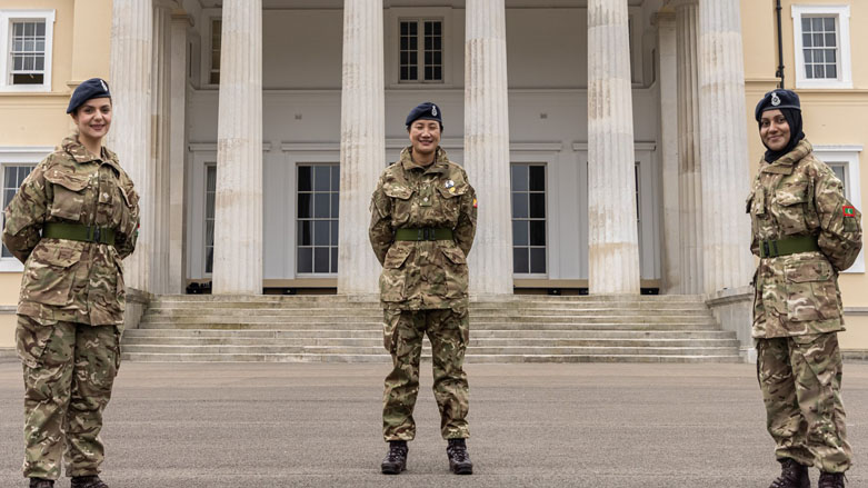 Midya Masti (left) stands at the parade square of Sandhurst along with two other female cadets graduating from the elite military academy, March 20, 2021. (Photo: British Army)